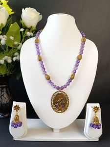 Transparent Glass Bead Necklace with Golden Pendant